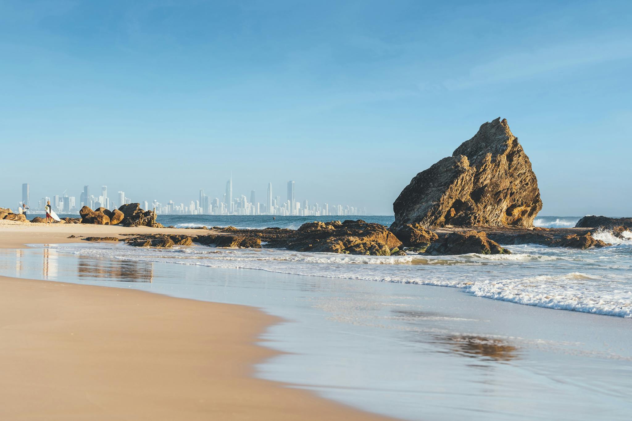 Elephant Rock on Currumbin Beach with the Gold Coast skyline in the distance